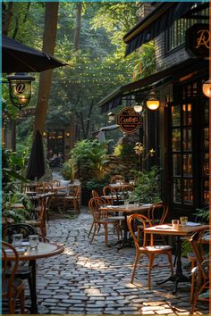 an outdoor restaurant with tables and chairs in the middle of it, surrounded by trees