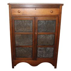 an old wooden cabinet with glass doors