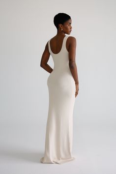 Indulge in the comfort and style of this elegant knit maxi dress. Crafted from premium quality yarns, it features a scoop neckline that adds a touch of sophistication to your wardrobe. Made from a heavy-weight stretchy fabrication, this modest design flatters the figure in an alluring way. Cute Maxi Dresses Modest, Elegant Dresses For Black Women, Balanced Outfits, Maxi Dress Black Women, Maxi Dress Styles, Knitt Maxi Dress, Casual Long Dress, Knit Maxi Dress, Knit Dresses