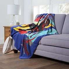 a couch with a blanket on top of it