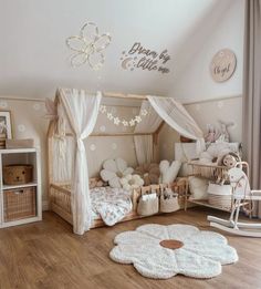 a child's bedroom decorated in pink and white