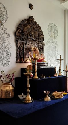 a table topped with lots of different types of items on top of a blue cloth