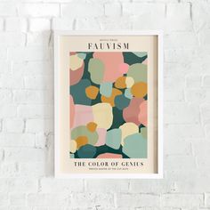 the color of genius poster hanging on a brick wall