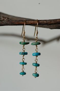 These earrings are beautiful and unique. They are a perfect addition to any outfit.  Each turquoise heishi bead was hand picked and wire hand formed to create the beautiful tiered style of these earrings.Thank you for supporting my small business! :)<3 Stephanie Turquoise Bohemian 14k Gold-filled Earrings, Turquoise 14k Gold Filled Bohemian Earrings, Bohemian Turquoise 14k Gold-filled Earrings, Bohemian Turquoise 14k Gold Filled Earrings, Turquoise Gold Bohemian Earrings, 14k Gold-filled Turquoise Jewelry With Ear Wire, Turquoise 14k Gold Filled Earrings, Turquoise 14k Gold-filled Earrings With Ear Wire, Turquoise 14k Gold Filled Drop Earrings