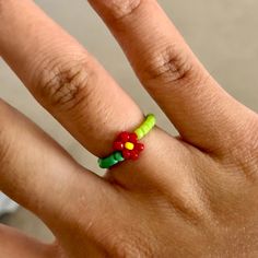 Handmade Red Flower Green Bead Stretch Ring. Adjustable Beaded Ring Jewelry Beaded Fruit Rings, Clay Bead Ring, Nameplate Ring, Western Rings, Urban Outfitters Jewelry, Nail Jewels, Diamond Heart Ring, Flower Handmade, Orange Stone