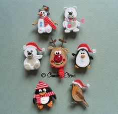 six different christmas themed pins on a table