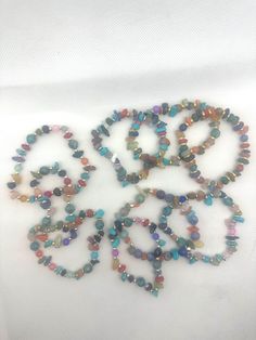 Multi-colored beaded bracelets made with natural stone gems, wooden beads, glass beads, turquoise, ceramic beads and gold/silver accents Ceramic Beads, Silver Accents, Jewellery Making, Last Minute Gifts, Wooden Beads, Bracelet Making, Multi Colored, Natural Stone, Natural Stones