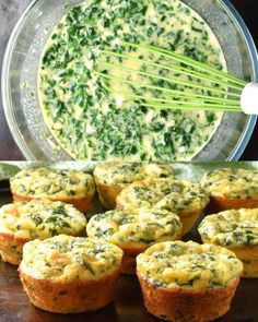 spinach and cheese muffins in a glass bowl with a whisk