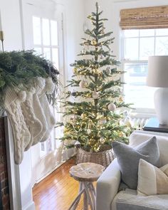 a living room with a christmas tree in the corner