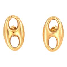 This lovely authentic pair of earrings by Gucci. Crafted from 18k yellow gold with a polished finish featuring a single long oval puffed link in stud style. Comes with standard post and has the designer hallmark with the gold content.    Brand:  Gucci   Hallmark: Gucci 750  Material: 18k yellow gold  Measurement: 0.65" long x 0.39" wide x 0.10" high  Weight: 2.3 grams Gucci Earrings Gold, Gucci Earrings, Stud Style, Link Earrings, Earrings Gold, Hallmark, Gold Earrings, Stud Earrings, Yellow Gold