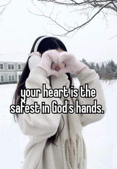 a girl in winter clothes covering her face with her hands and the words your heart is the