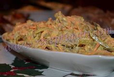 a white bowl filled with food on top of a table