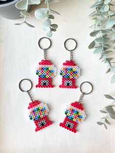 three keychains made to look like legos