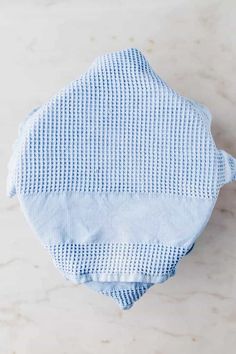 a blue and white diaper sitting on top of a table