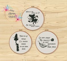 three cross stitch hoop art designs on wood