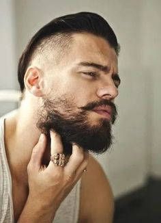 If you want to grow long hair down to the bottom of your chin and below on the neck, then you can achieve a rugged, wilder look. However, grow too much hair below your neckline and you’ll develop a nasty neck beard. Learn how to trim your neckline here. Patchy Beard Styles, Hipster Haircut, Great Beards, Beard Love, Beard Tattoo, Grow Beard