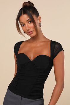 From club cuties to flirty fashionistas, everyone will love the Lulus Exceptional Flirtation Black Mesh Ruched Cutout Short Sleeve Top! Stretchy mesh fabric shapes this elevated top with short, cap sleeves and a sweetheart neckline (with hidden no-slip strips). Fitted, ruched bodice features padded cups and hidden underwire support. Turn around to reveal a flirty back cutout that will keep all eyes on you. Fit: This garment fits true to size. Length: Size medium measures 21" from shoulder to hem Over The Shoulder Top Outfits, Short Sleeve Mesh Top, Sheer Short Sleeve Mesh Top For Party, Ruched Fitted Top For Party, Fitted Nylon Mesh Top For Evening, Fitted Short Sleeve Mesh Top For Party, Fitted Short Sleeve Mesh Top For Night Out, Fitted Nylon Tops For Evening, Ruched Nylon Tops For Summer