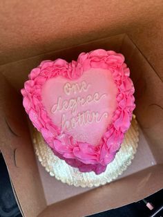 a pink heart shaped cake in a box with writing on it that says, one deepest love