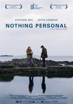 the movie poster for nothing personal with two people standing on rocks in front of water