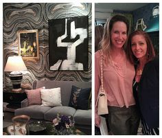 two women standing next to each other in front of a living room with couches and paintings on the wall