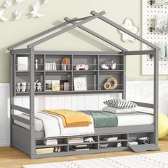 a child's bedroom with a bed and bookcase in the shape of a house