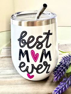 the best mom ever wine tumbler is next to some purple flowers and lavenders