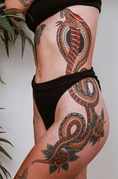 a woman with a tattoo on her stomach