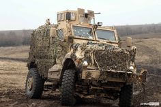 an army vehicle is parked in the mud