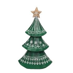 a green ceramic christmas tree with a star on top