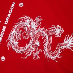 a red t - shirt with a white dragon on it