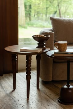 two wooden tables sitting on top of a hard wood floor