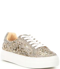 From Blue by Betsey Johnson&#x2C; the Reily Rhinestone Platform Sneakers feature:Fabric upper with allover rhinestone embellishmentsLace up closureSynthetic liningSynthetic outsoleApprox. 1" platform heightImported. Casual Lace-up Platform Sneakers With Rhinestones, Bedazzled Low-top Synthetic Sneakers, Silver Rhinestone Low-top Sneakers, Betsey Johnson Sparkle Sneakers, Slip-on Synthetic Sneakers With Rhinestones, Rhinestone Sneakers, Bridal Sneakers, Blue By Betsey Johnson, Platform Sneakers