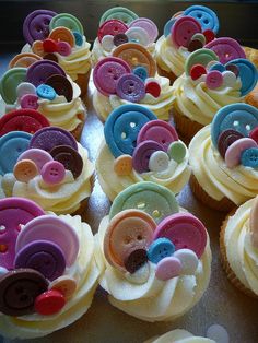 cupcakes decorated with buttons and sprinkles