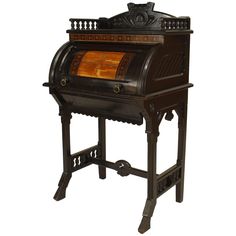 an old fashioned wooden stove with ornate carvings