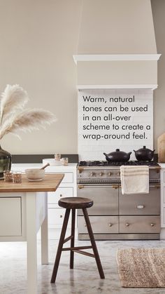 a kitchen with an oven, counter top and stools in front of the stove