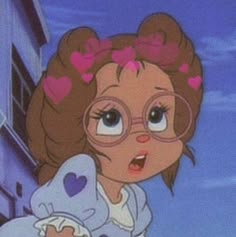 a cartoon girl with glasses and hearts on her hair is looking at the camera while standing in front of a building