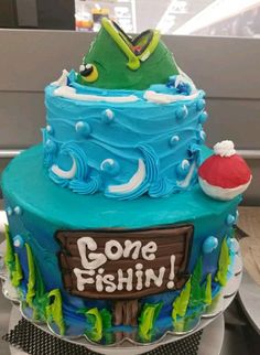 there is a cake that says gone fishing on it