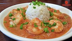 a white plate topped with shrimp and rice