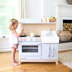 This play kitchen is crafted from durable, eco-friendly wood, which can withstand hours of imaginative play. It is designed with safety in mind and features non-toxic finishes, making it safe for even the youngest chefs. Watch your little one cook up endless fun with this beautifully crafted, long-lasting play kitchen. Ideal for sparking creativity and developing motor skills, the Essential Play Kitchen is a must-have for any playroom. Add the Essential Play Kitchen Hood for expanded play & stor Kitchen With Hood, Wooden Toy Kitchen, Play Kitchen Accessories, Cooking Competition, Kitchen Hood, Magnolia Baby, Kitchen Dimensions, Kitchen Hoods, Bow Shop