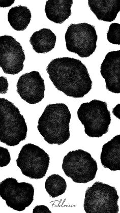 an animal print with black spots on it