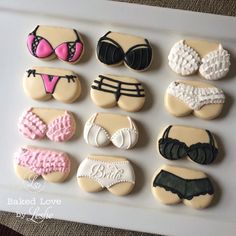 decorated cookies in the shape of bikinis and bras on a white platter