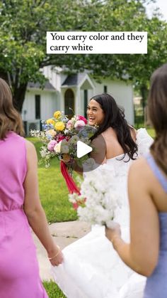 a woman in a wedding dress holding a bouquet and walking with two other women behind her