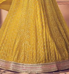 COLOR : Saffron Yellow FABRIC : Top - Premium Georgette, Bottom - Santoon, Dupatta - Nazmin Chiffon WORK : Heavy Resham Embroidery, Zari, Stones, Heavy Sequin Work, Lace Border OCCASION : Wedding, Reception, Sangeet, Mehendi, Party Wear, Bridal Wear READY-TO-WEAR : NoSTITCHING : Available as semi-stitched fabric, can be stitched using standard size option (+$30). Note: There might be a slight color variation due to lighting and flash used during photoshoot. The bright shade seen is the best clos Gold Anarkali Floor-length Churidar, Gold Anarkali Churidar Floor-length, Floor-length Anarkali Set With Intricate Embroidery For Festivals, Floor-length Cutdana Churidar For Wedding, Gold Floor-length Anarkali Set With Cutdana, Floor-length Anarkali Set With Intricate Embroidery For Navratri, Gold Floor-length Churidar For Navratri, Diwali Floor-length Anarkali Set With Intricate Embroidery, Yellow Anarkali Set For Reception