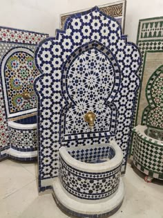 an ornate fountain surrounded by tile work