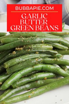 garlic butter green beans on a white plate