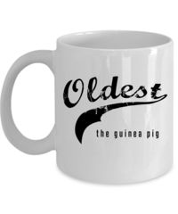 a white coffee mug with the words oldest and the gung in black on it