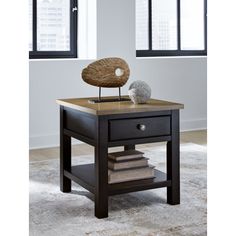 an end table with a rock on top