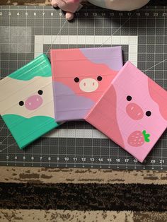 three little pigs are sitting on top of a piece of crafting paper with scissors