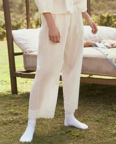 Perfect for slow mornings at home, The Eyelet Easy Sleep Pant. is the epitome of elevated comfort. Crafted from supersoft and lightweight cotton voile fabric, the pant is adorned with a Victorian-inspired eyelet lace trim and finished with a delicate scalloped edge. Designed for an easy pull-on fit with an elasticated waistband, these pants pair back to the matching The Eyelet Tank. or your favorite tee for a relaxed yet coordinated look. 100% Cotton Machine Wash Cold, Lay Flat to Dry Import Cotton Trousers Sleepwear For Spring, Cotton Sleepwear Trousers For Spring, Spring Cotton Sleepwear Trousers, Spring Cotton Sleepwear Pants, Cotton Wide Leg Sleepwear For Relaxation, Wide Leg Cotton Sleepwear For Relaxation, Summer Cotton Sleepwear For Relaxing At Home, Cotton Sleepwear Straight Pants, Summer Loungewear Sleepwear Straight Pants