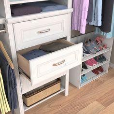 an organized closet with clothes and shoes